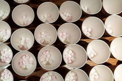 Paper cups containing small marshmallows