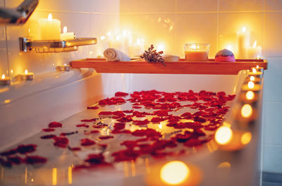 Spiritual aura cleansing flower bath for full moon ritual with candles, aroma salt, lavender 