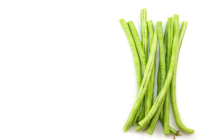 Directly above shot of vegetables against white background