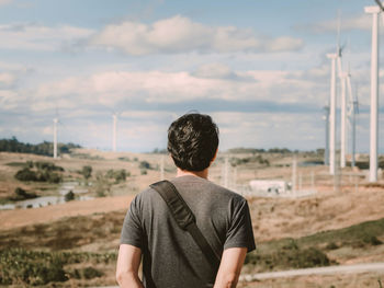 Rear view of man standing on land