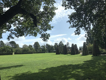 Trees on field against sky