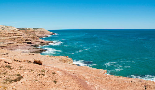 View of beach against blue sky