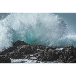 Close-up of waves in sea against sky