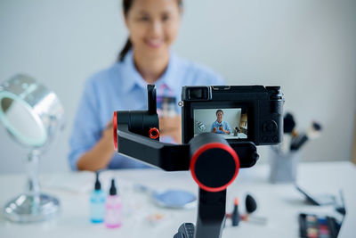 Portrait of woman photographing