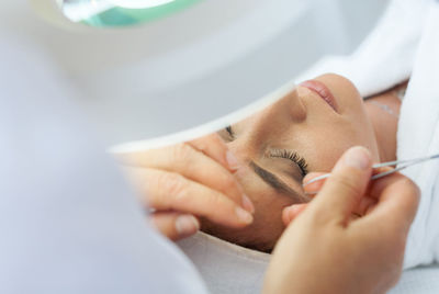 Close-up of woman holding hands