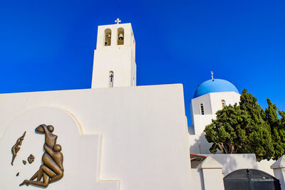 Low angle view of building against clear blue sky