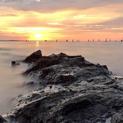 Scenic view of sea at sunset