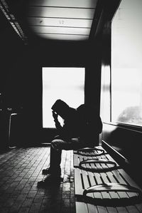 Man sitting on chair at home