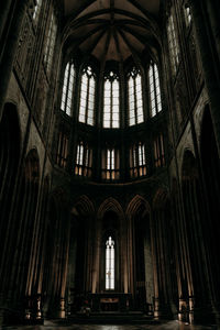 Low angle view of stained glass window in building