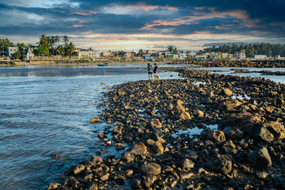 Scenic view of sea shore against sky