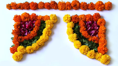 High angle view of multi colored candies against white background