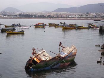 Boats moored in sea