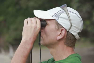 Close-up of woman using mobile phone outdoors