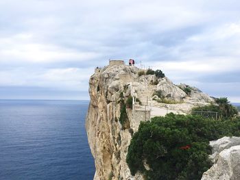 Scenic view of cap de formentor against cloudy sky