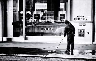 Woman standing on city street