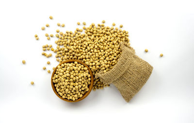 High angle view of bread in plate against white background