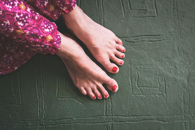 Low section of woman sitting on floor