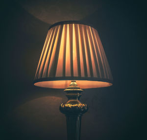 Close-up of illuminated lamp at home