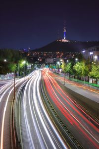 High angle view of light trails on street at night