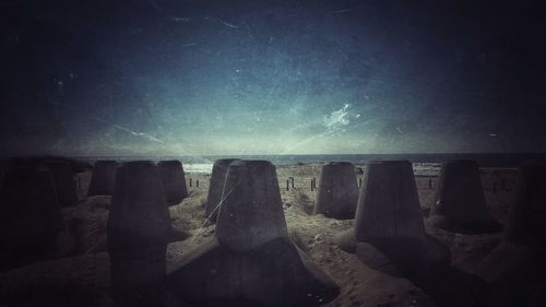 Scenic view of beach against sky at night