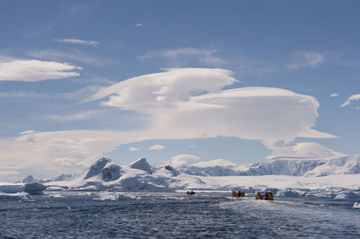 Scenic view of snowcapped mountains against sky