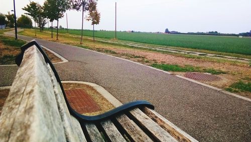 Road by landscape against sky