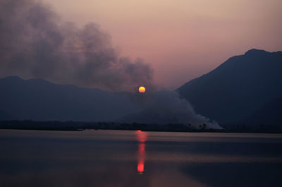Scenic view of mountains against sky at sunset