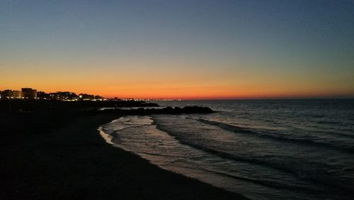 Scenic view of calm sea at sunset