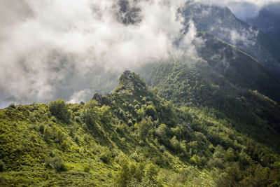 Scenic view of waterfall against sky