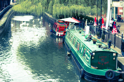 Boats in river with buildings in background