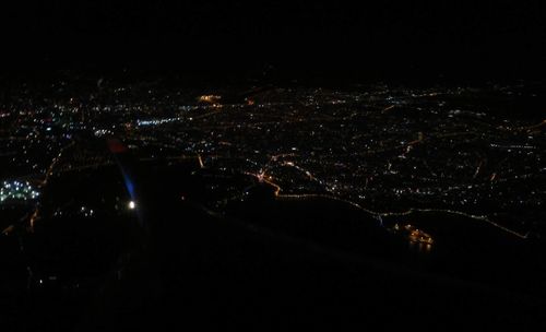 Low angle view of illuminated sky at night