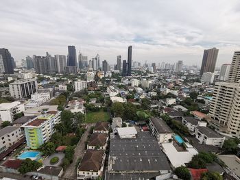 High angle view of buildings in city against sky