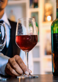 Close-up of wineglass at table