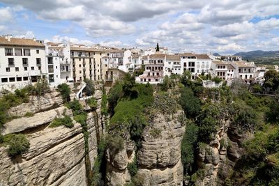 View of buildings against cloudy sky