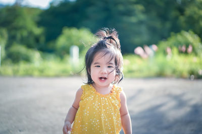 Portrait of cute girl standing outdoors