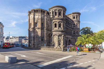 Group of people in front of historical building