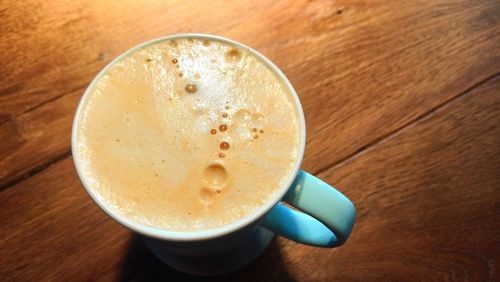 High angle view of coffee cup on table