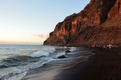 Scenic view of beach against sky during sunset