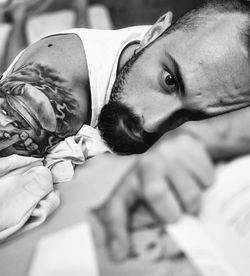 Close-up portrait of man lying down