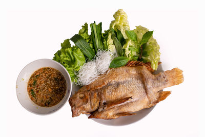 Close-up of fresh vegetables against white background