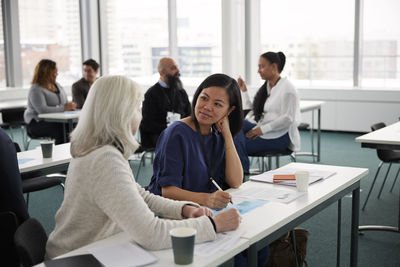 Business people having seminar in office