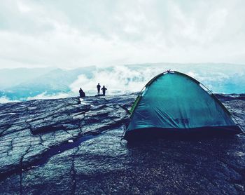 Close-up of tent on mountain against sky