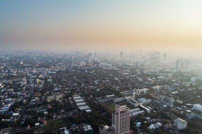 High angle view of buildings in city against sky