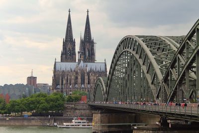 Bridge over river with buildings in background