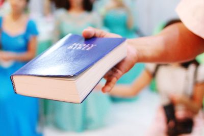 Close-up of boy holding book