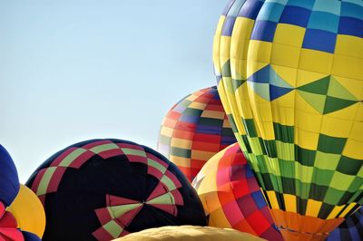 Close-up of colorful hot air balloons against clear sky