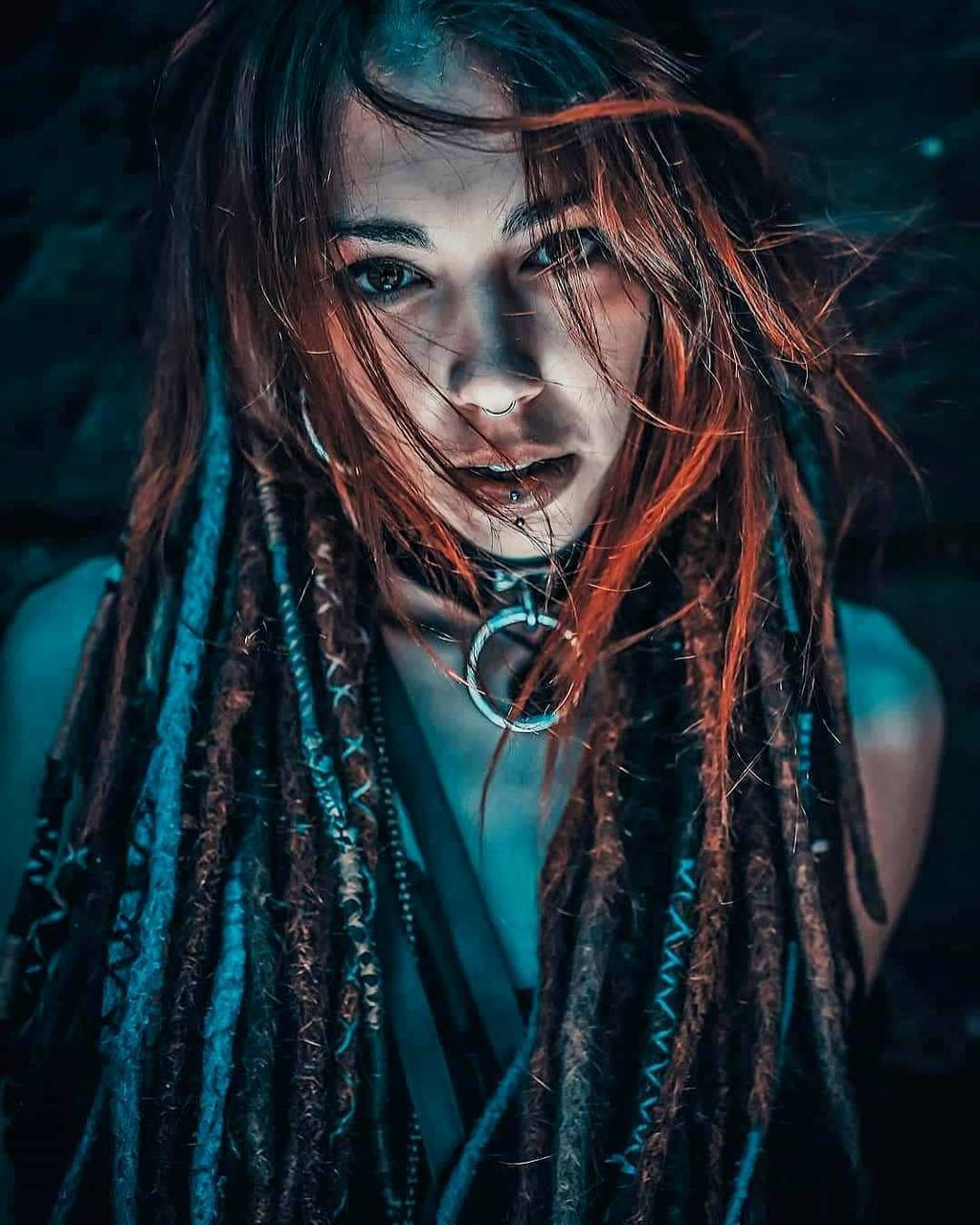 dreadlocks, one person, hairstyle, long hair, portrait, adult, women, blue, young adult, human hair, darkness, headshot, arts culture and entertainment, looking at camera, emotion, female, night, fashion, brown hair, music, nature, looking