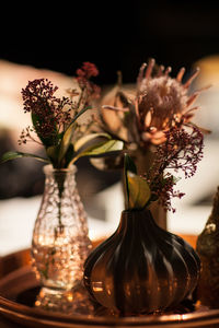 Close-up of flowering plants in vase on table