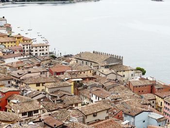 High angle view of townscape by sea