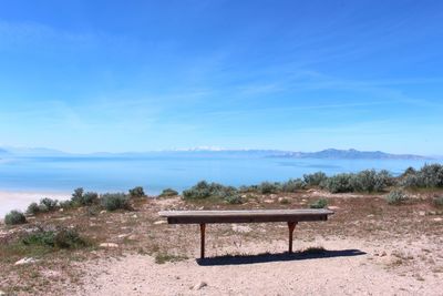 Scenic view of sea against blue sky